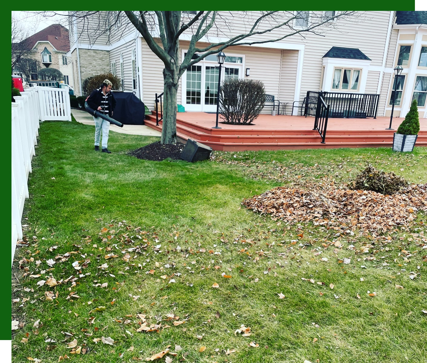 guy removing leafs with a leaf blower